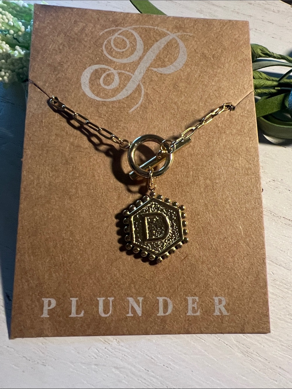 Plunder “D” gold tone necklace